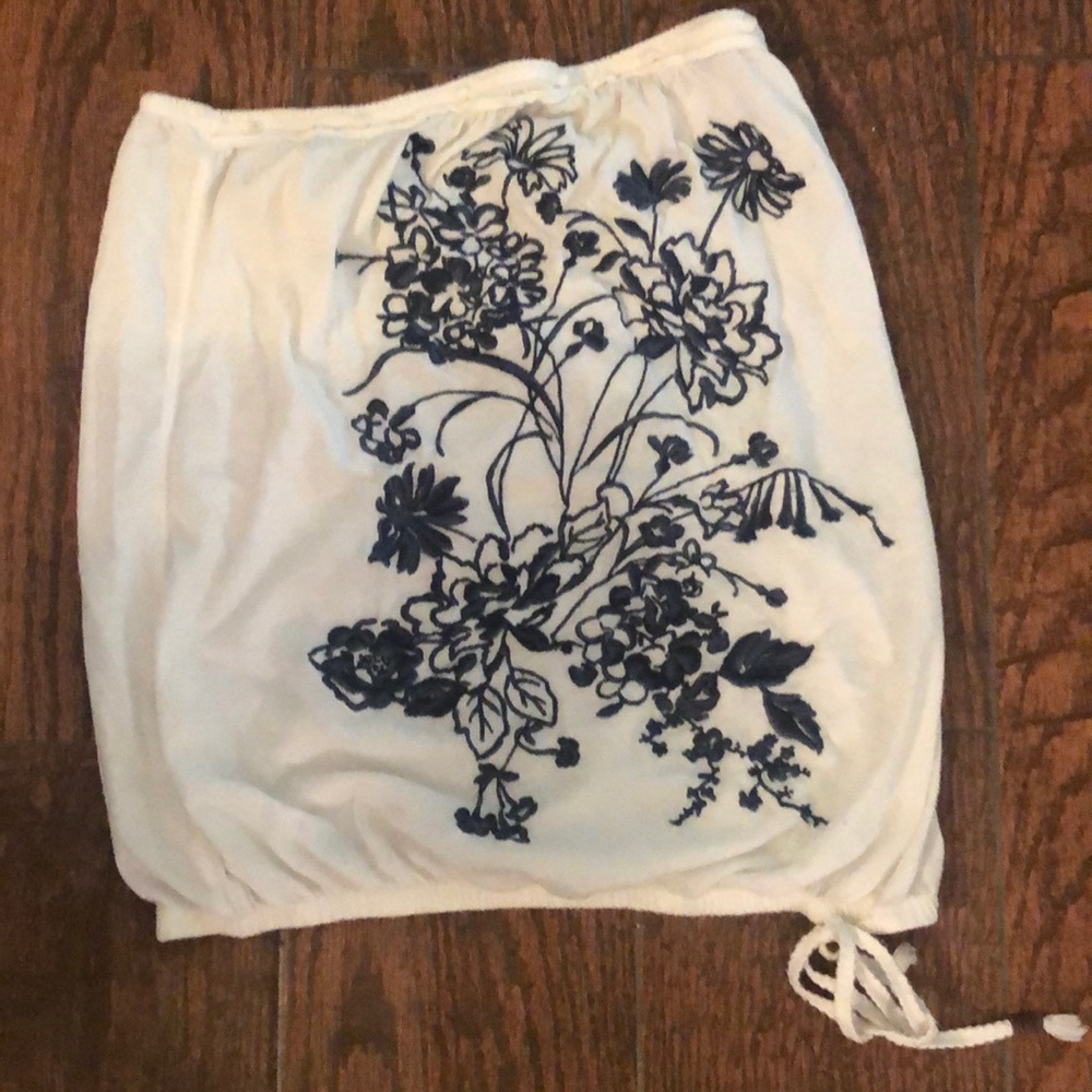 White with blue embroidery